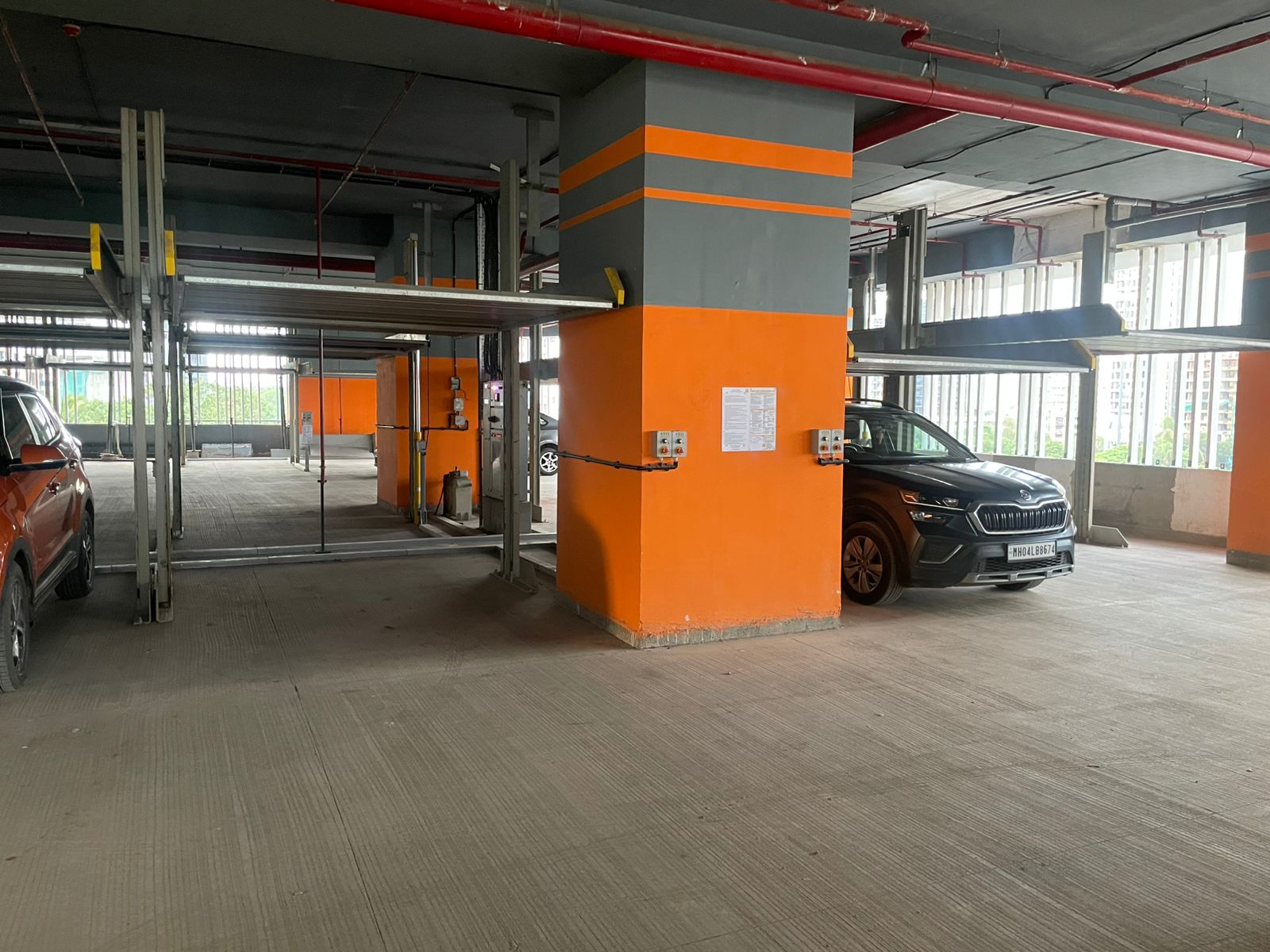 Self leveling compound being spread across a prepared concrete floor